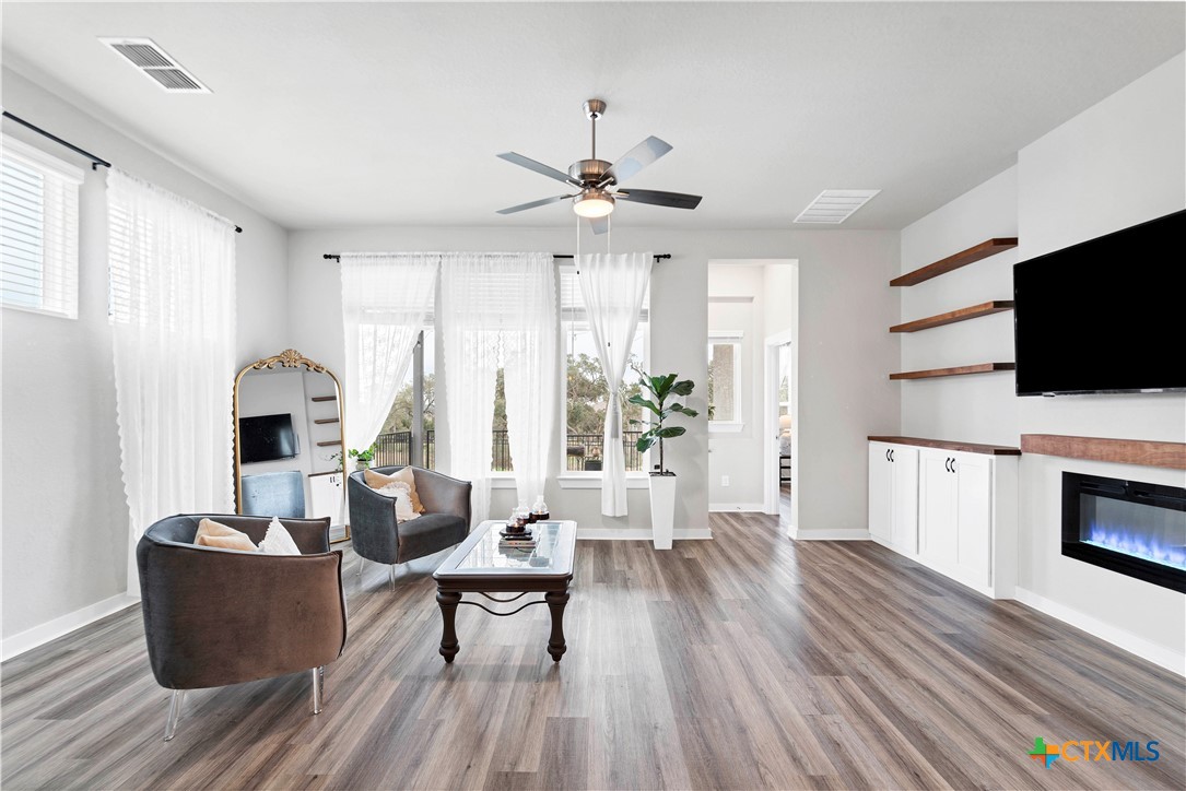 1616 Craftsman Road New Braunfels, TX 78132 - Photo 14 of 29 a living room with furniture and a flat screen tv