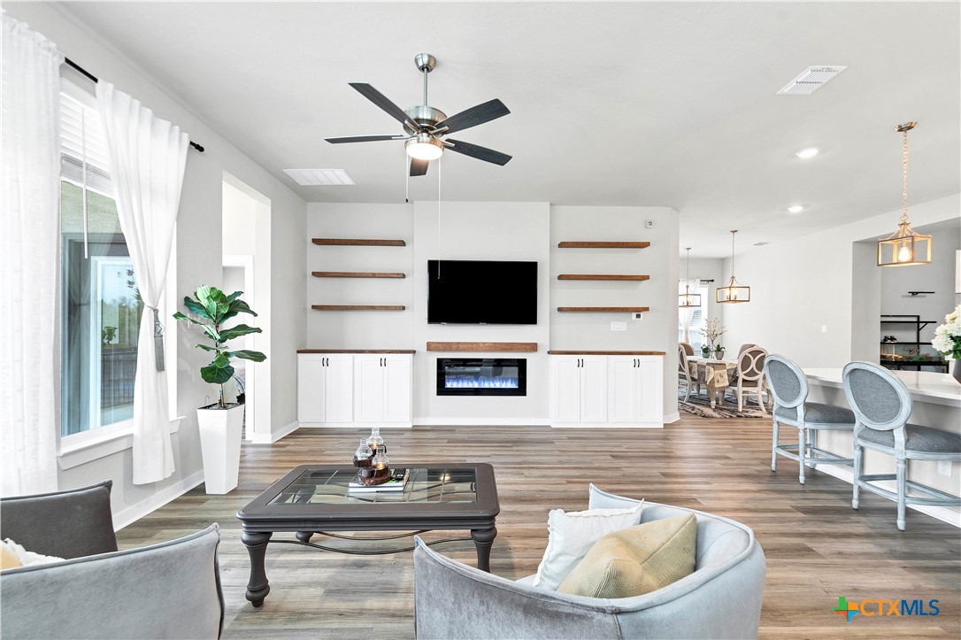 1616 Craftsman Road New Braunfels, TX 78132 - Photo 15 of 29 a living room with furniture and a flat screen tv