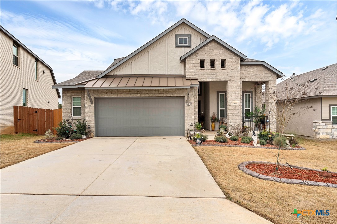 1616 Craftsman Road New Braunfels, TX 78132 - Photo 2 of 29 a front view of a house with a yard