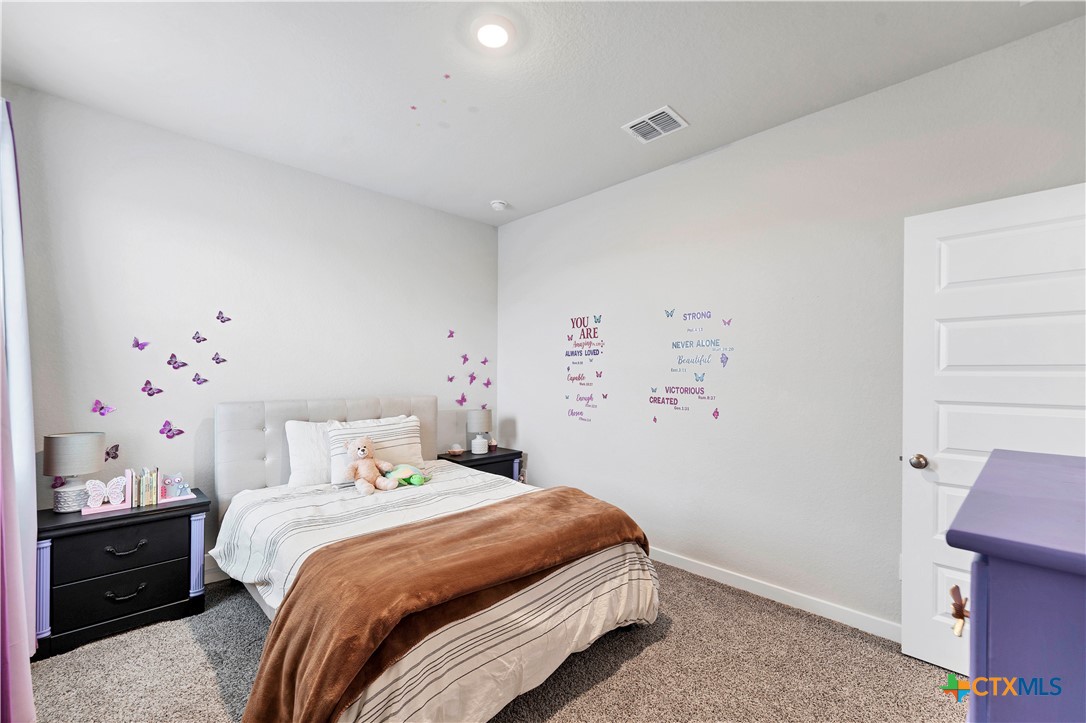 1616 Craftsman Road New Braunfels, TX 78132 - Photo 25 of 29 a bedroom with a bed and a window