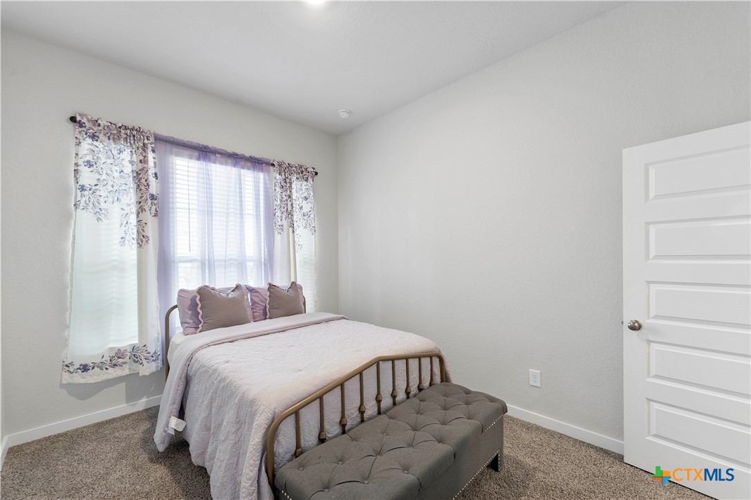 1616 Craftsman Road New Braunfels, TX 78132 - Photo 5 of 29 a bedroom with a bed and a window