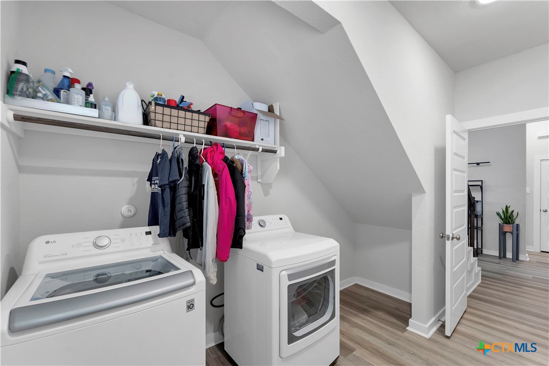 1616 Craftsman Road New Braunfels, TX 78132 - Photo 8 of 29 a view of storage and utility room with washer and dryer