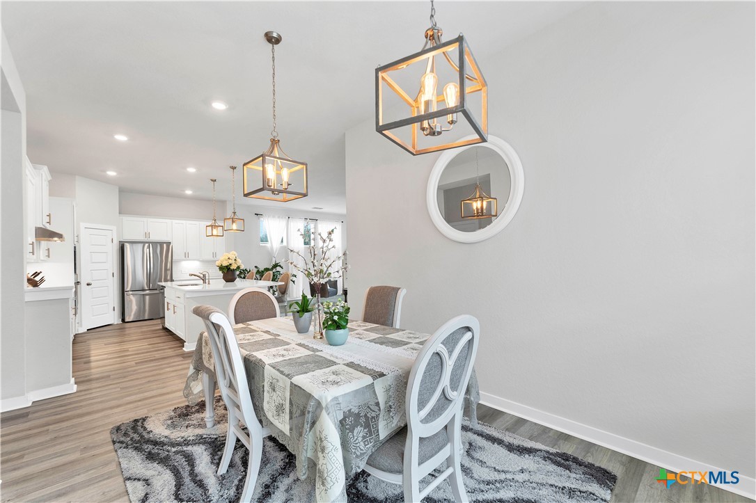 1616 Craftsman Road New Braunfels, TX 78132 - Photo 9 of 29 a view of a dining room with furniture