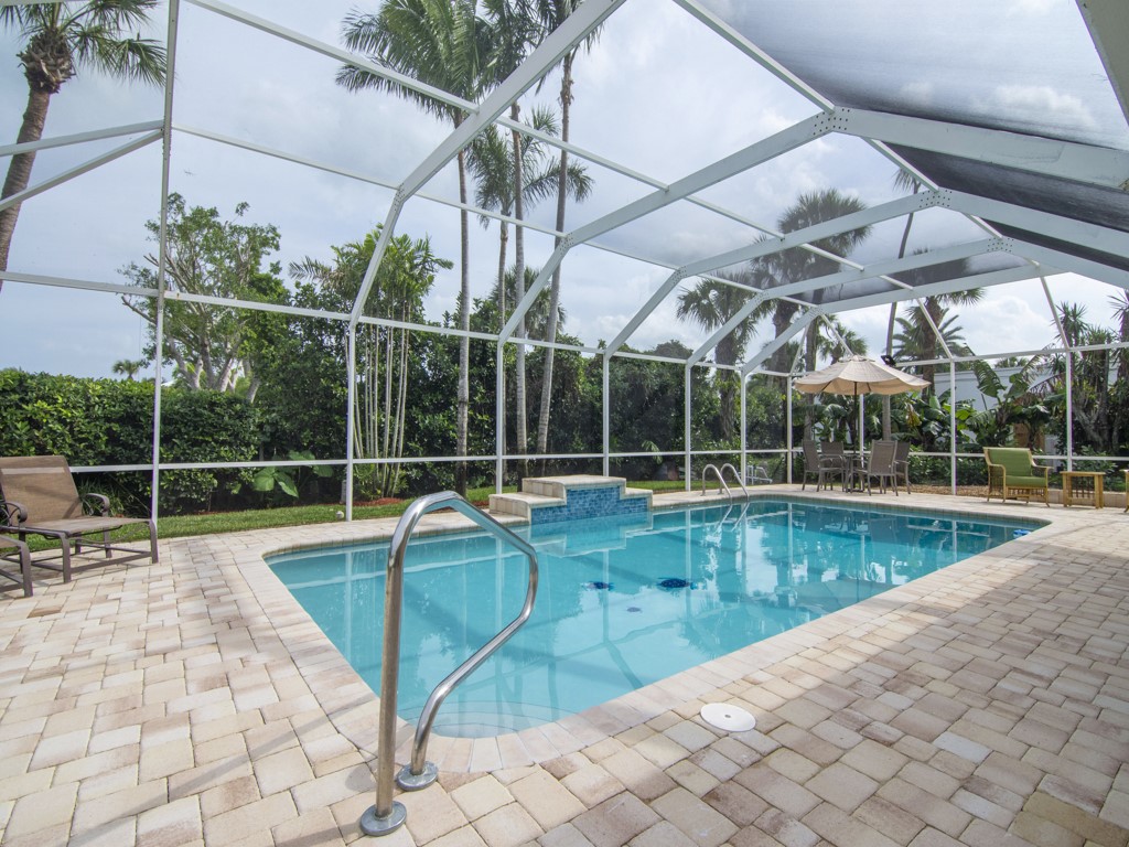 a view of a swimming pool with a patio