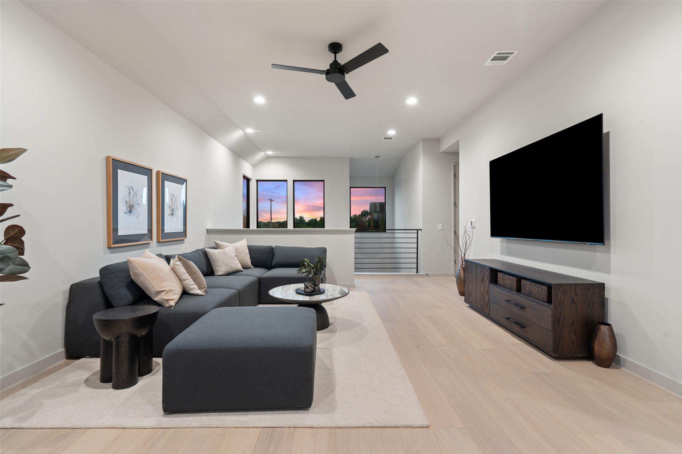 9803 Ribelin Ranch Court Austin, TX 78750 - Photo 24 of 34 Natural light streams into this generously proportioned living room, highlighted by clean lines and modern design.