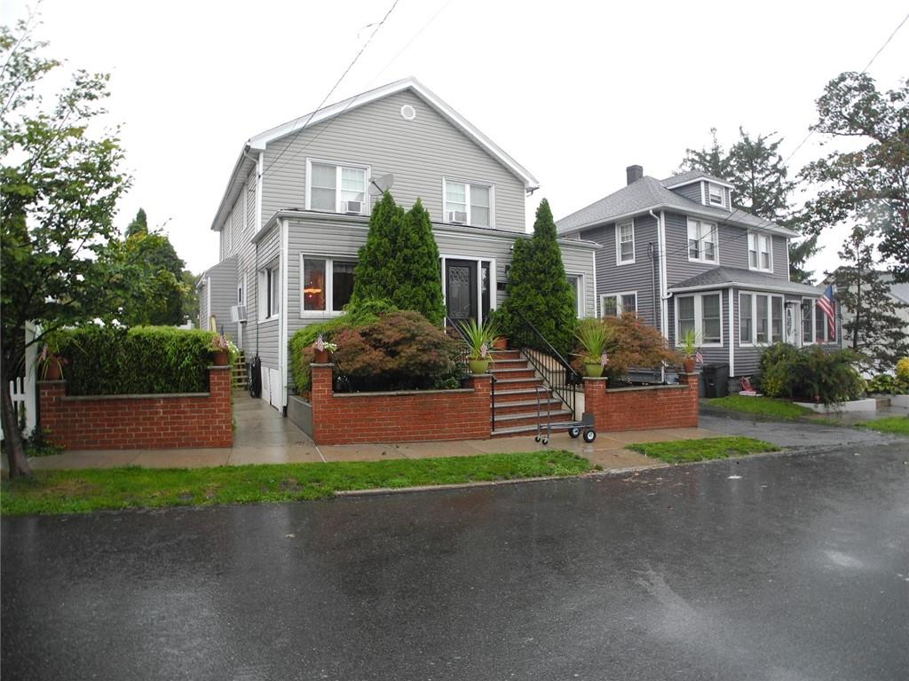 211 Kirby Street Bronx, NY 10464 - Photo 1 of 1 a front view of house with yard and green space