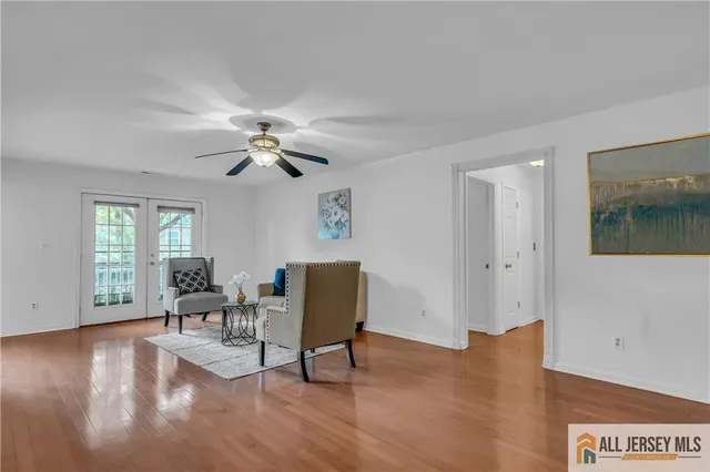 a view of a livingroom with furniture and wooden floor