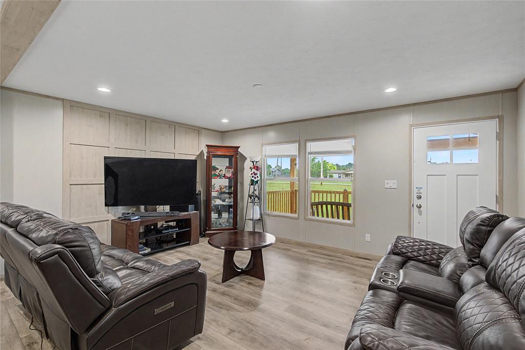6065 Timber Trail Azle, TX 76020 - Photo 9 of 33 a living room with furniture and a flat screen tv