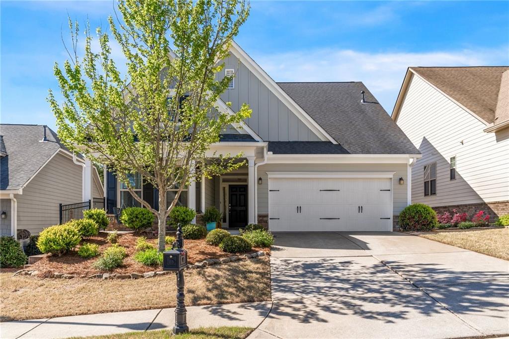 a front view of a house with garden