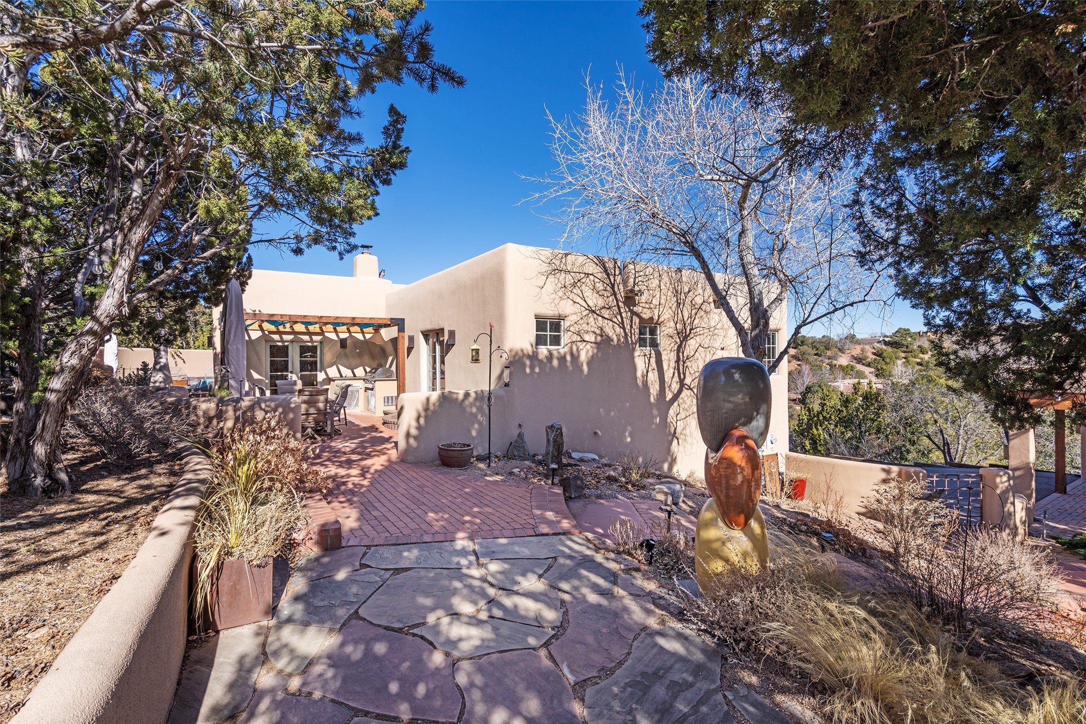 1204 Bandolina Road Santa Fe, NM 87501 - Photo 54 of 69 Path back to main house back patio from Casita