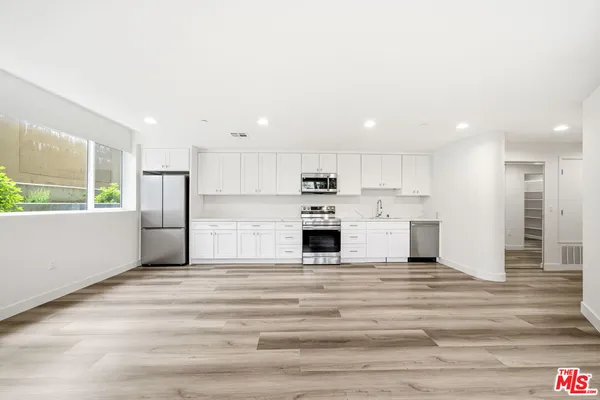 a view of a kitchen with a sink