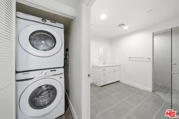 a view of a hallway with washer and dryer