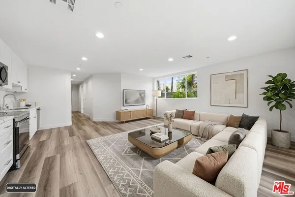a living room with furniture and a table