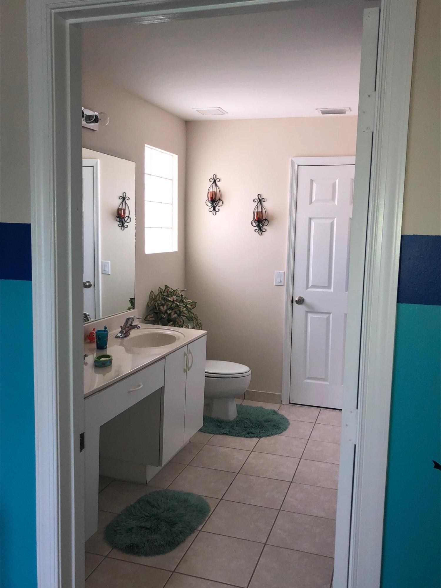 6006 Adriatic Way Greenacres, FL 33413 - Photo 23 of 33 2nd floor bathroom