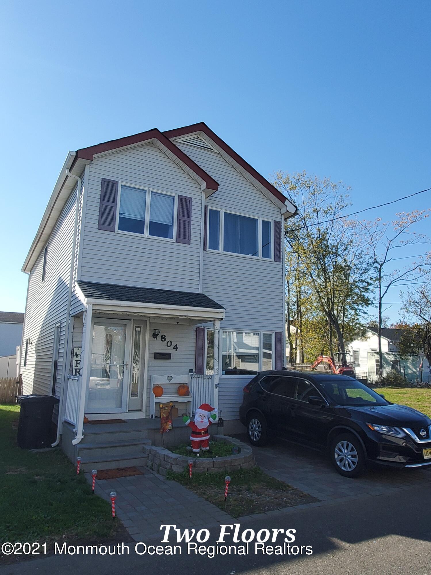 804 7th Street Union Beach, NJ 07735 - Photo 1 of 14 a front view of a house with garden