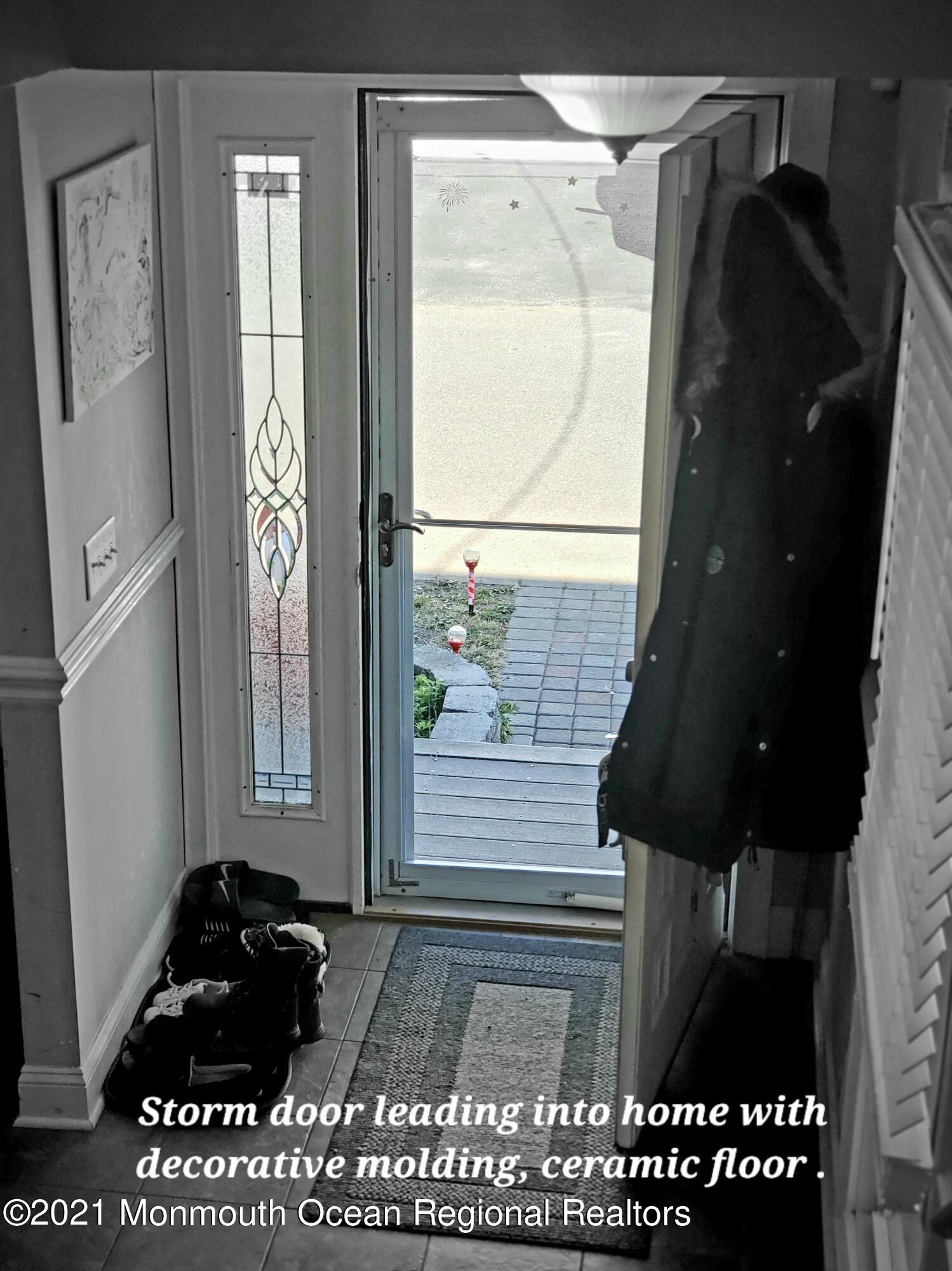 804 7th Street Union Beach, NJ 07735 - Photo 3 of 14 a black car parked in front of a window