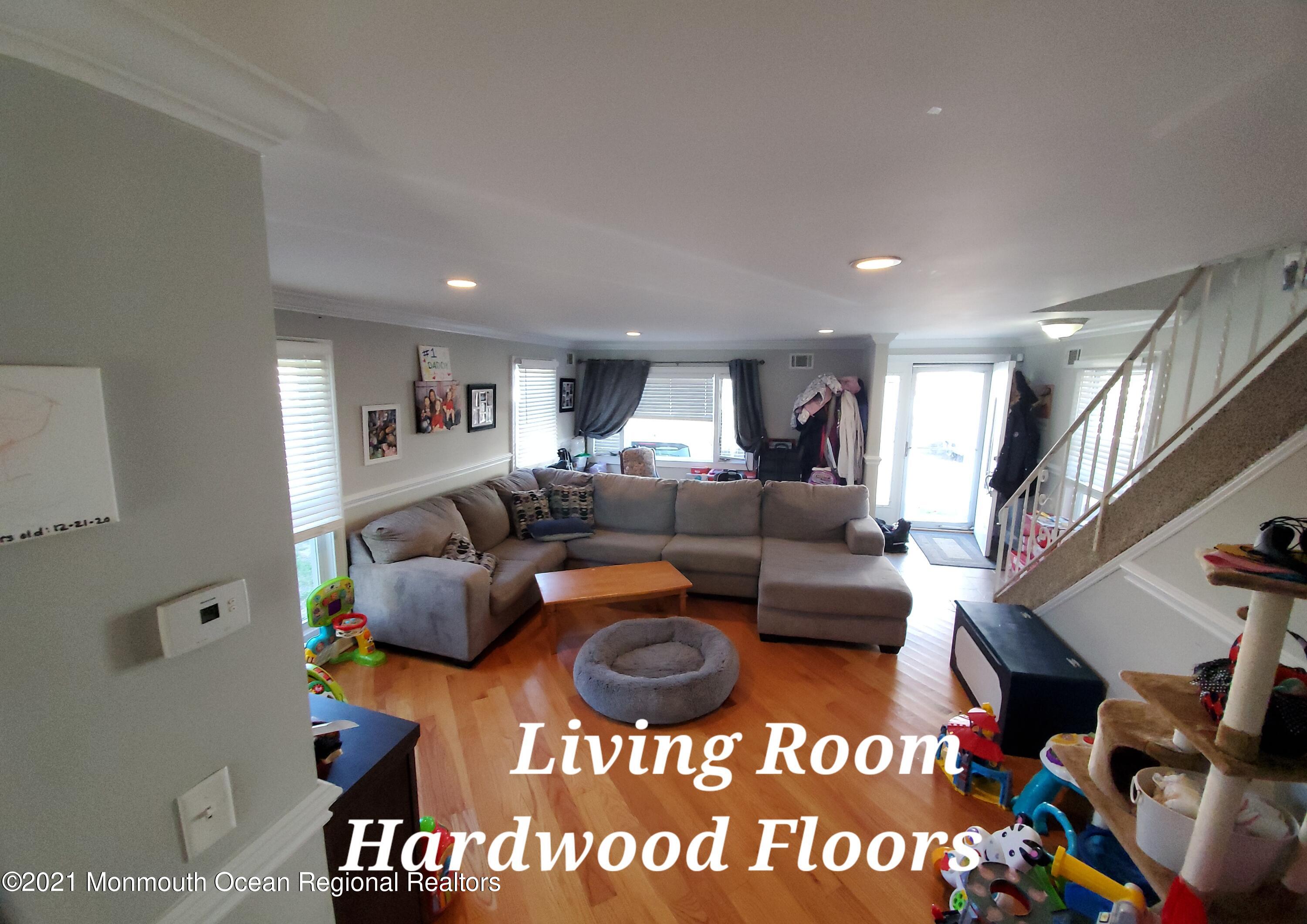 804 7th Street Union Beach, NJ 07735 - Photo 4 of 14 a living room with furniture and a wooden floor