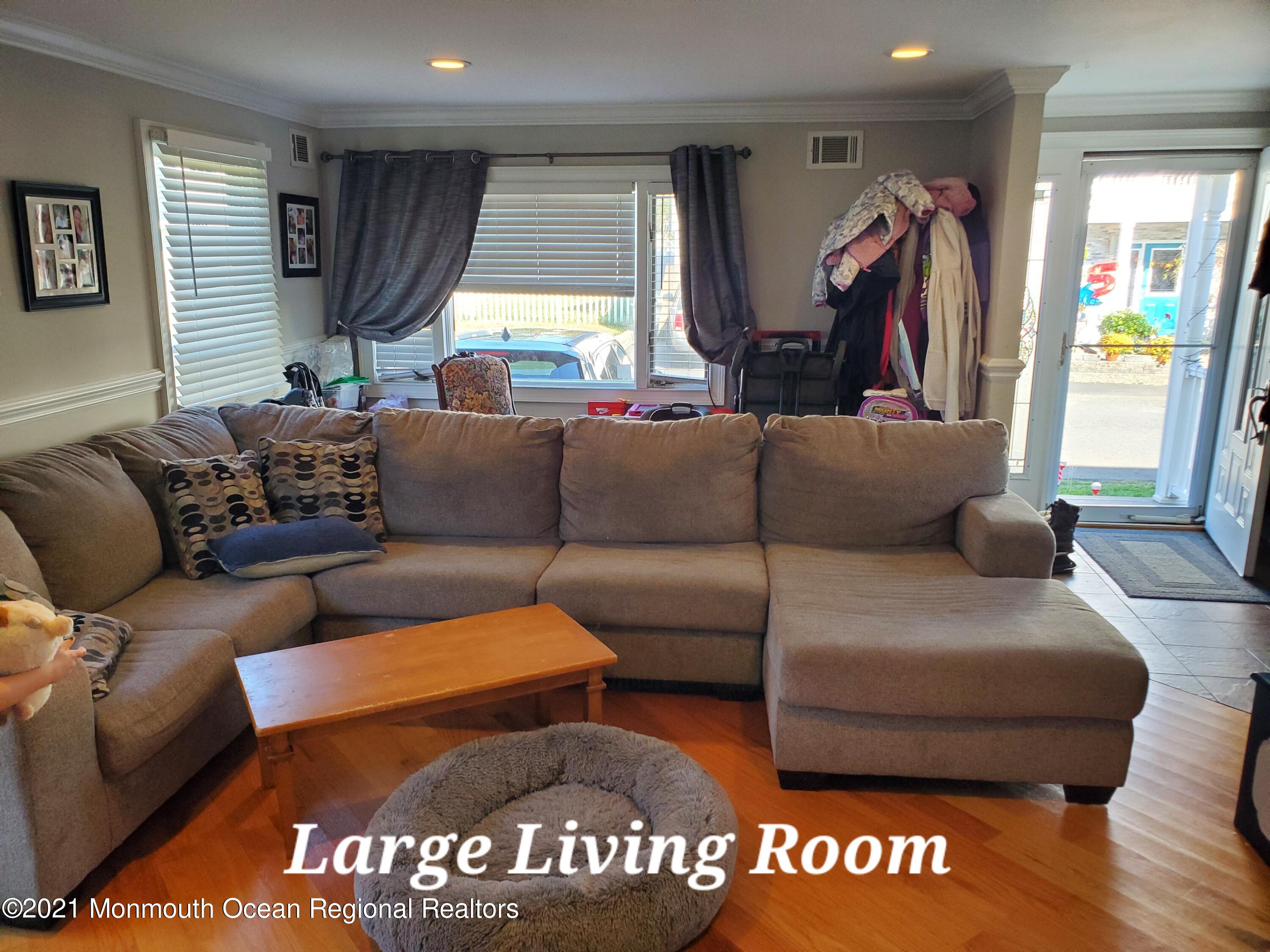 804 7th Street Union Beach, NJ 07735 - Photo 5 of 14 a living room with furniture and a large window