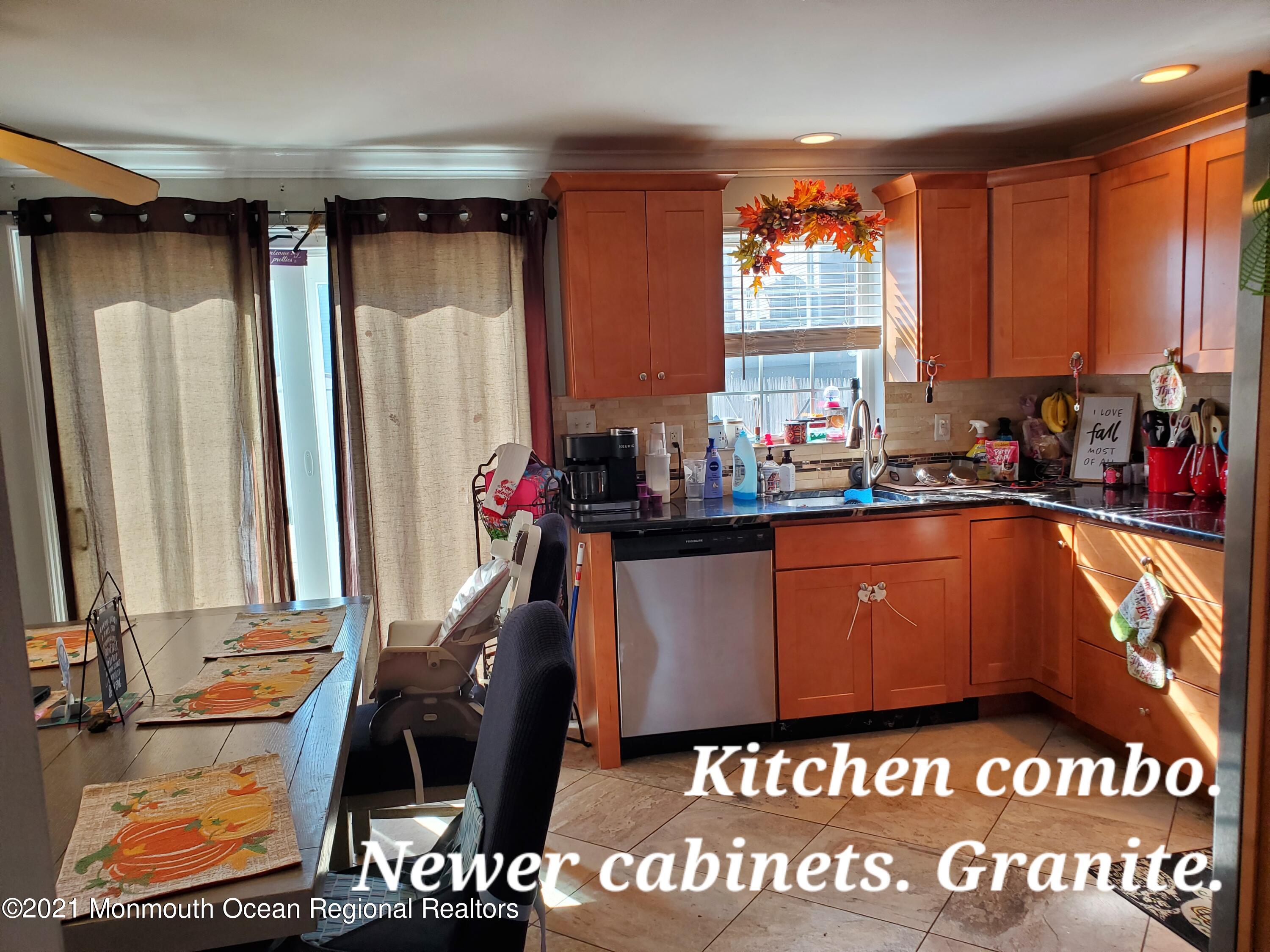 804 7th Street Union Beach, NJ 07735 - Photo 7 of 14 a view of a living room with furniture and a window