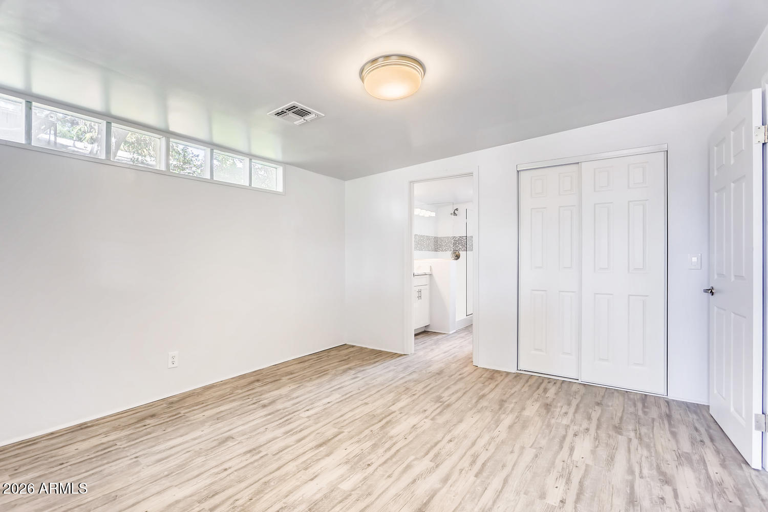 1215 South Judd Street Tempe, AZ 85281 - Photo 8 of 18 a view of empty room with wooden floor