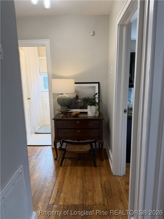 211 North Dickson Street Raeford, NC 28376 - Photo 12 of 14 a view of hallway with wooden floor and furniture