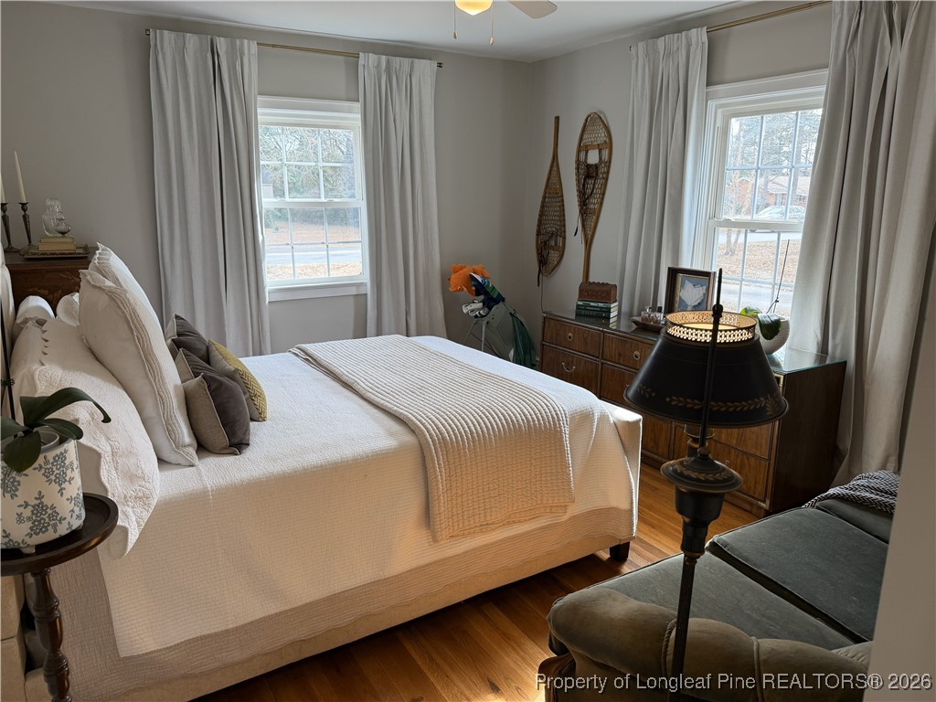 211 North Dickson Street Raeford, NC 28376 - Photo 13 of 14 a bedroom with a bed and a window