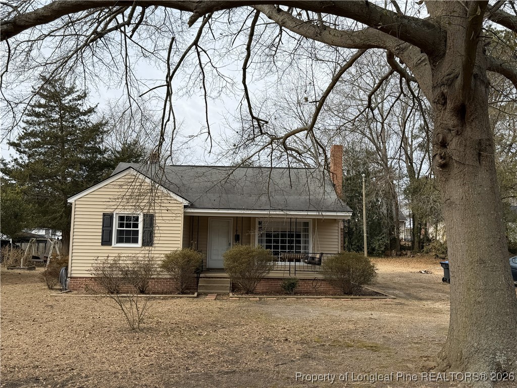 211 North Dickson Street Raeford, NC 28376 - Photo 3 of 14 front view of house with a yard
