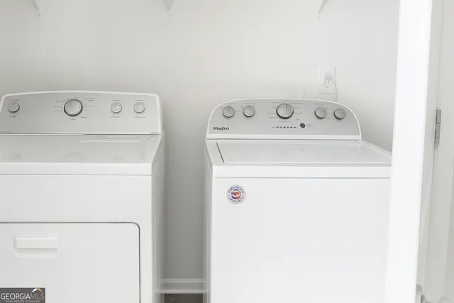 a utility room with dryer and washer