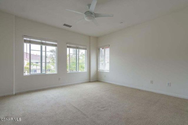 a bathroom with a bathtub a double vanity sink and a mirror