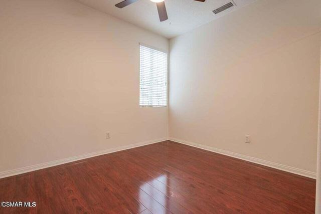 a view of a hallway with wooden floor and entryway