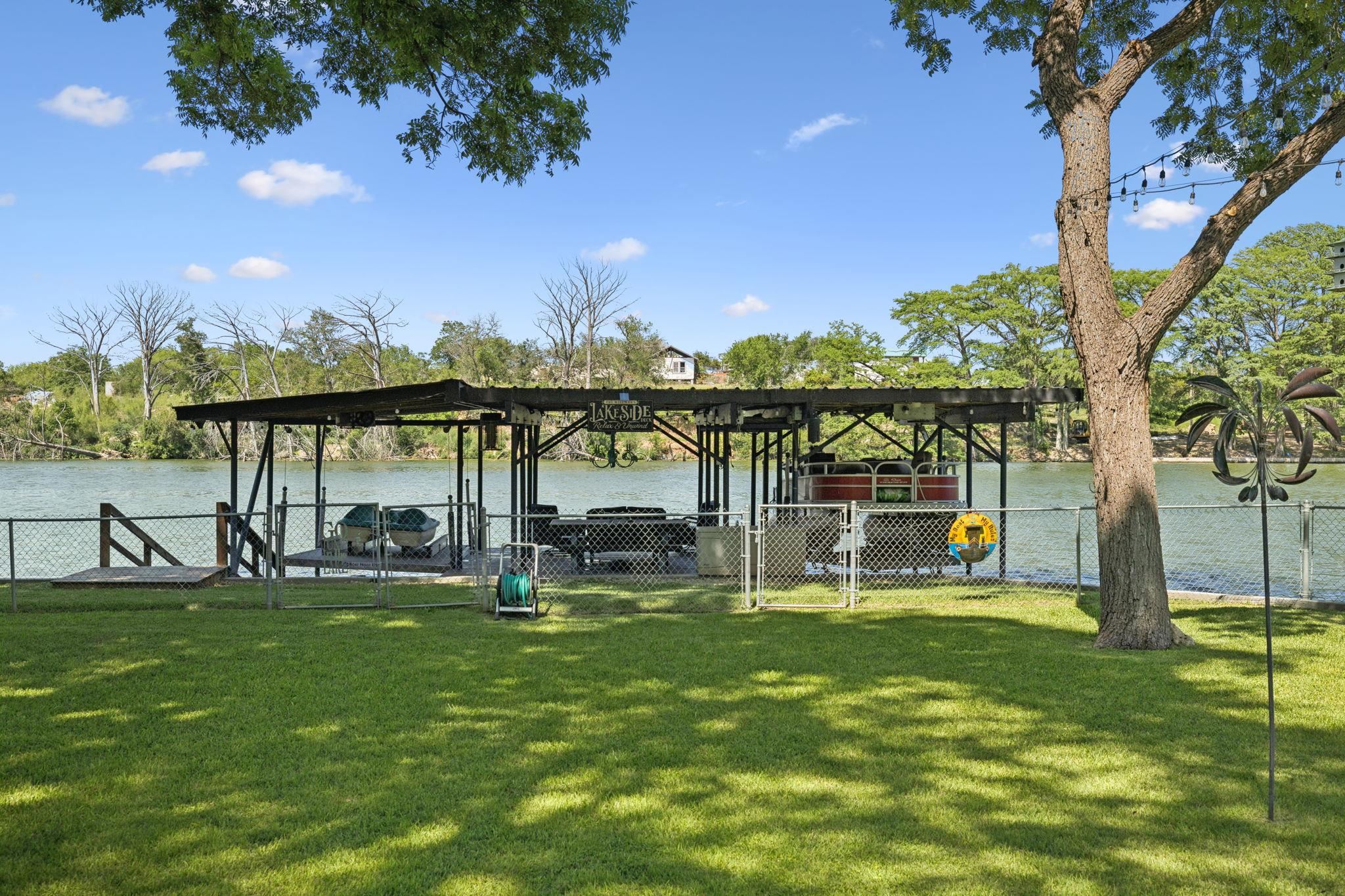 1435 East Zipp Road New Braunfels, TX 78130 - Photo 6 of 43 a view of a lake with a garden