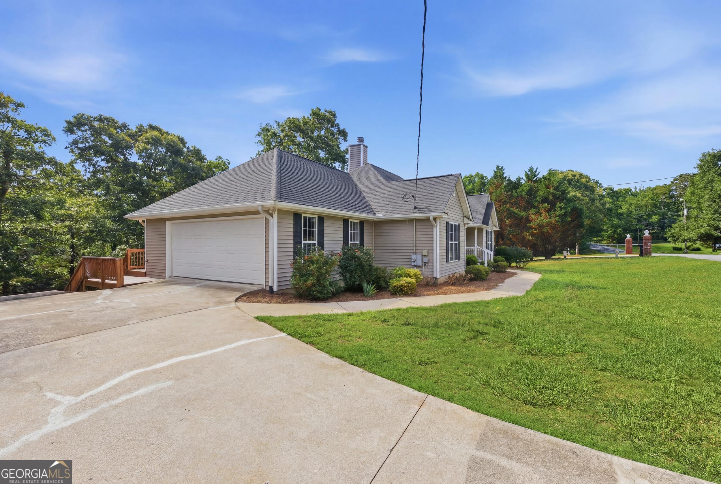 171 Winding Way Hartwell, GA 30643 - Photo 37 of 37 a front view of a house with a garden and yard