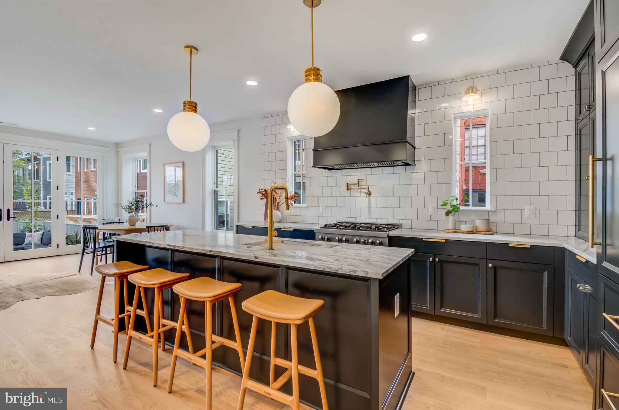 326 D Street Northeast Washington, DC 20002 - Photo 10 of 53 a kitchen with granite countertop a sink and a stove