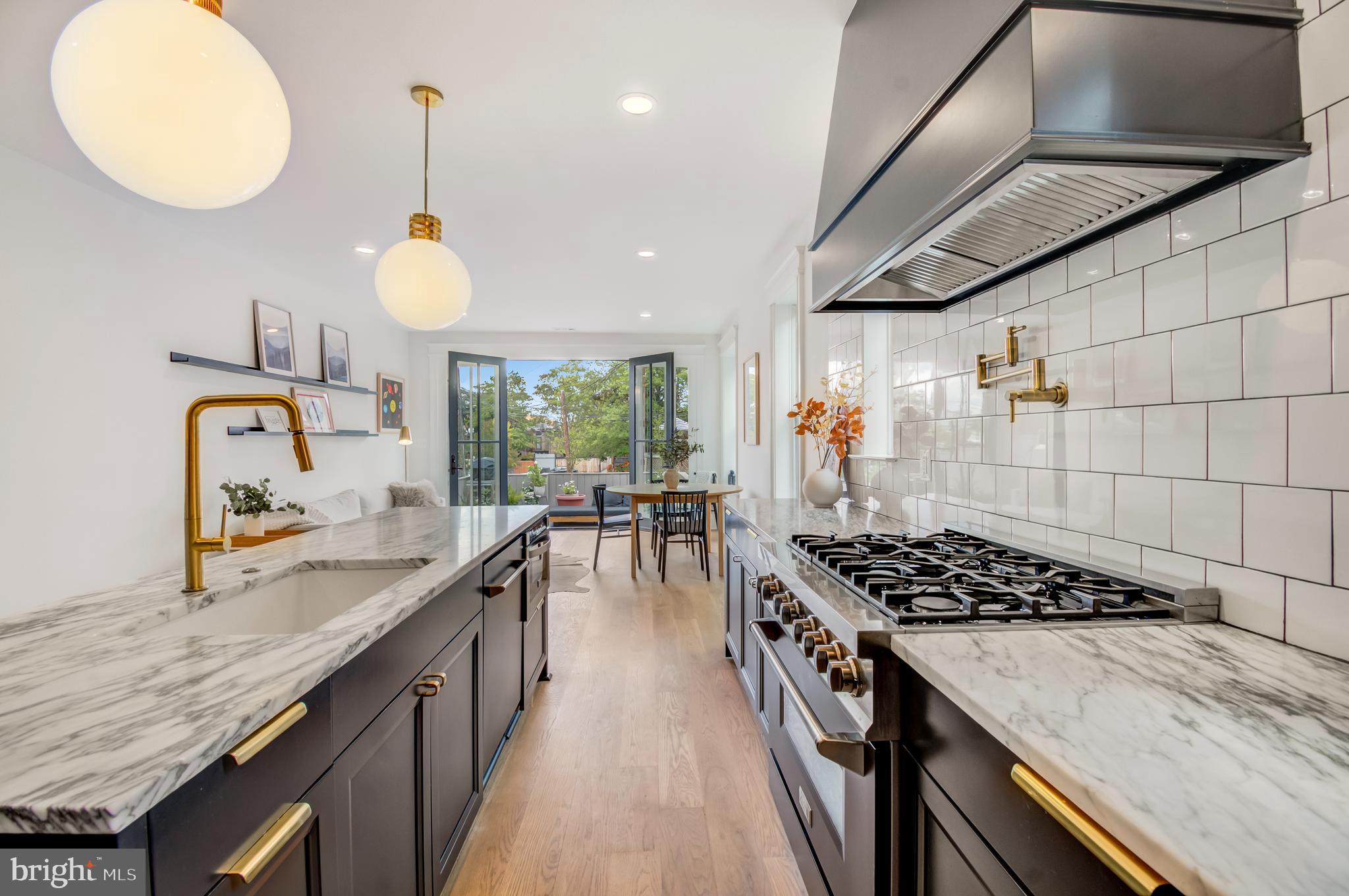 326 D Street Northeast Washington, DC 20002 - Photo 11 of 53 a kitchen with stove and a sink