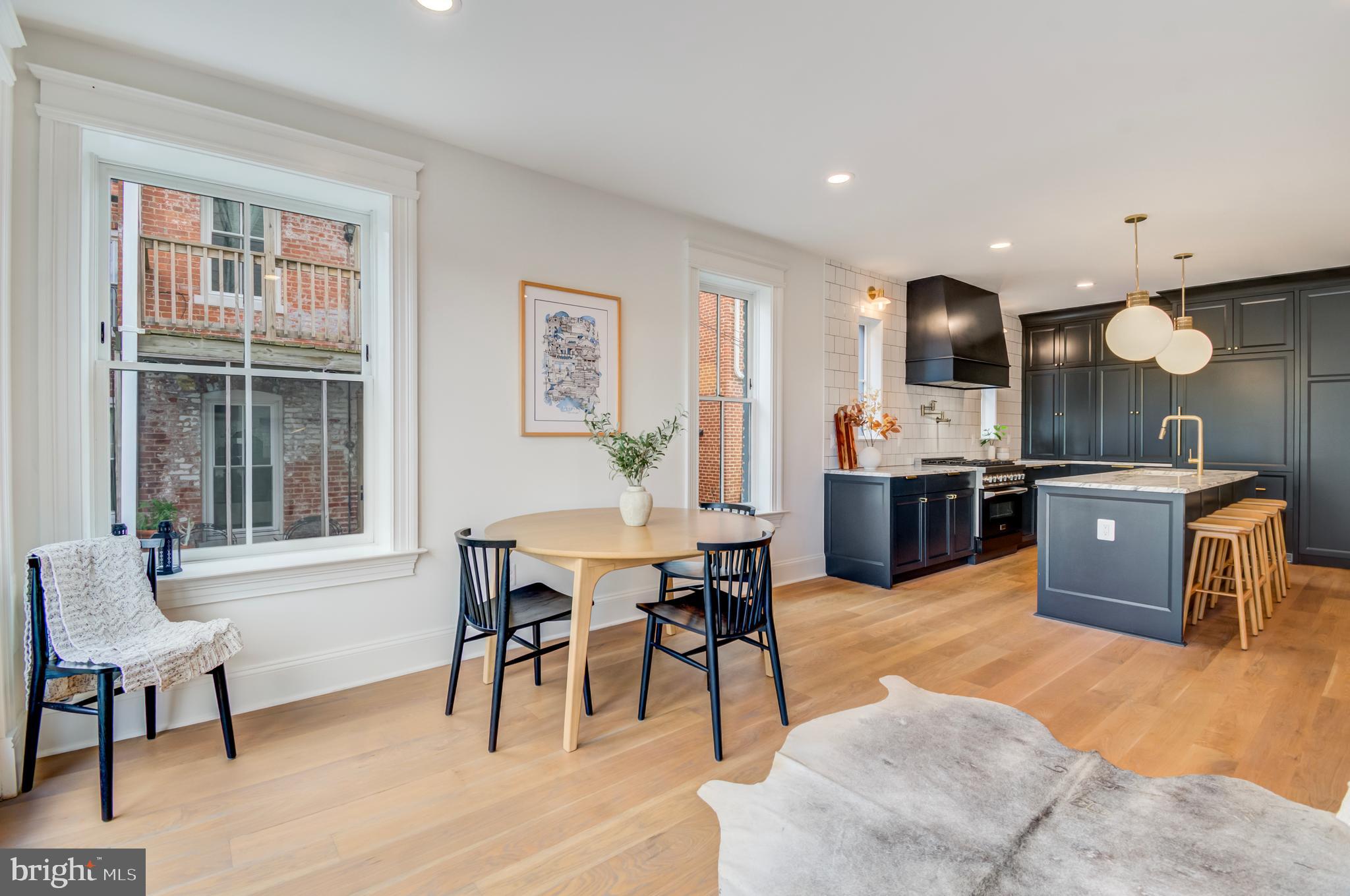 326 D Street Northeast Washington, DC 20002 - Photo 12 of 53 a living room with furniture kitchen view and a wooden floor