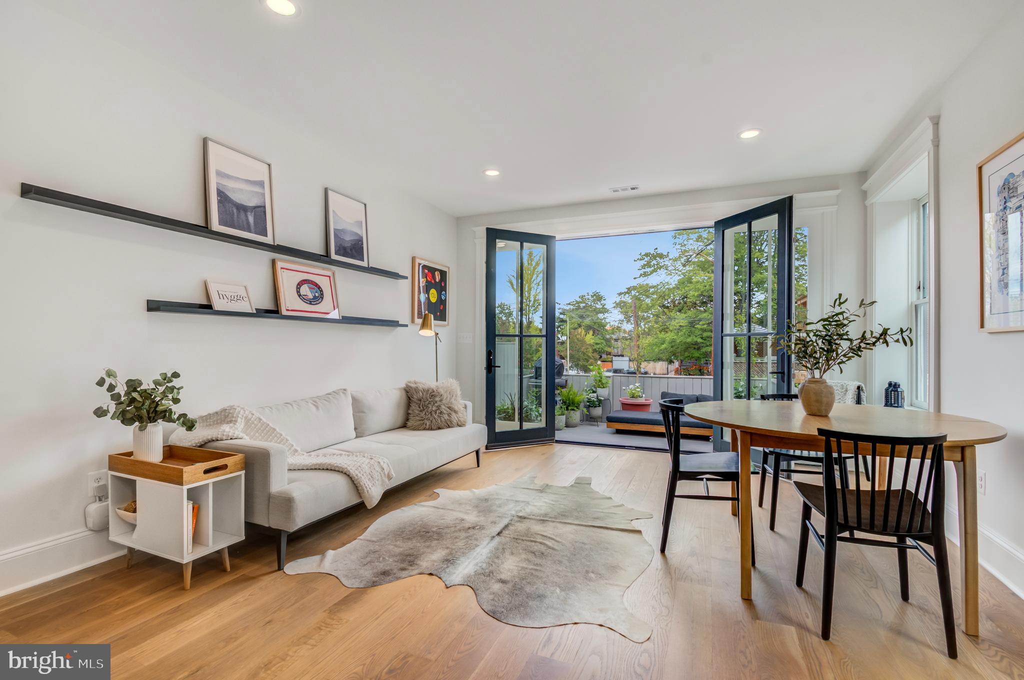 326 D Street Northeast Washington, DC 20002 - Photo 13 of 53 a living room with furniture and a large window