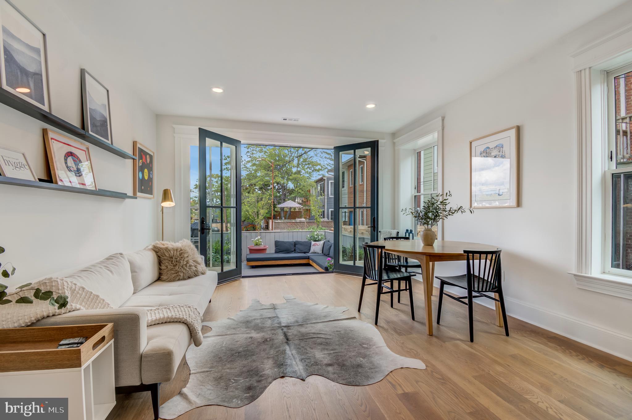 326 D Street Northeast Washington, DC 20002 - Photo 15 of 53 a living room with furniture and a table