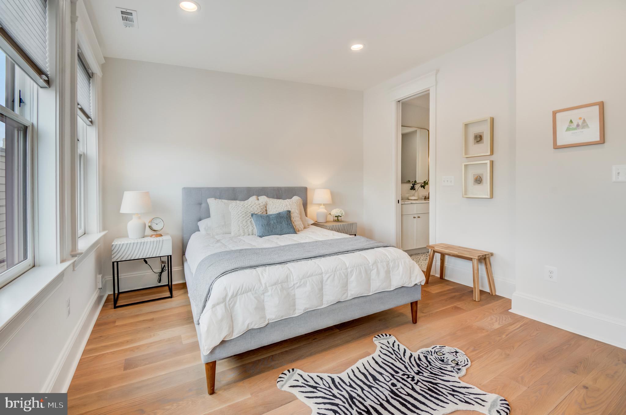 326 D Street Northeast Washington, DC 20002 - Photo 22 of 53 a bedroom with a bed and wooden floor