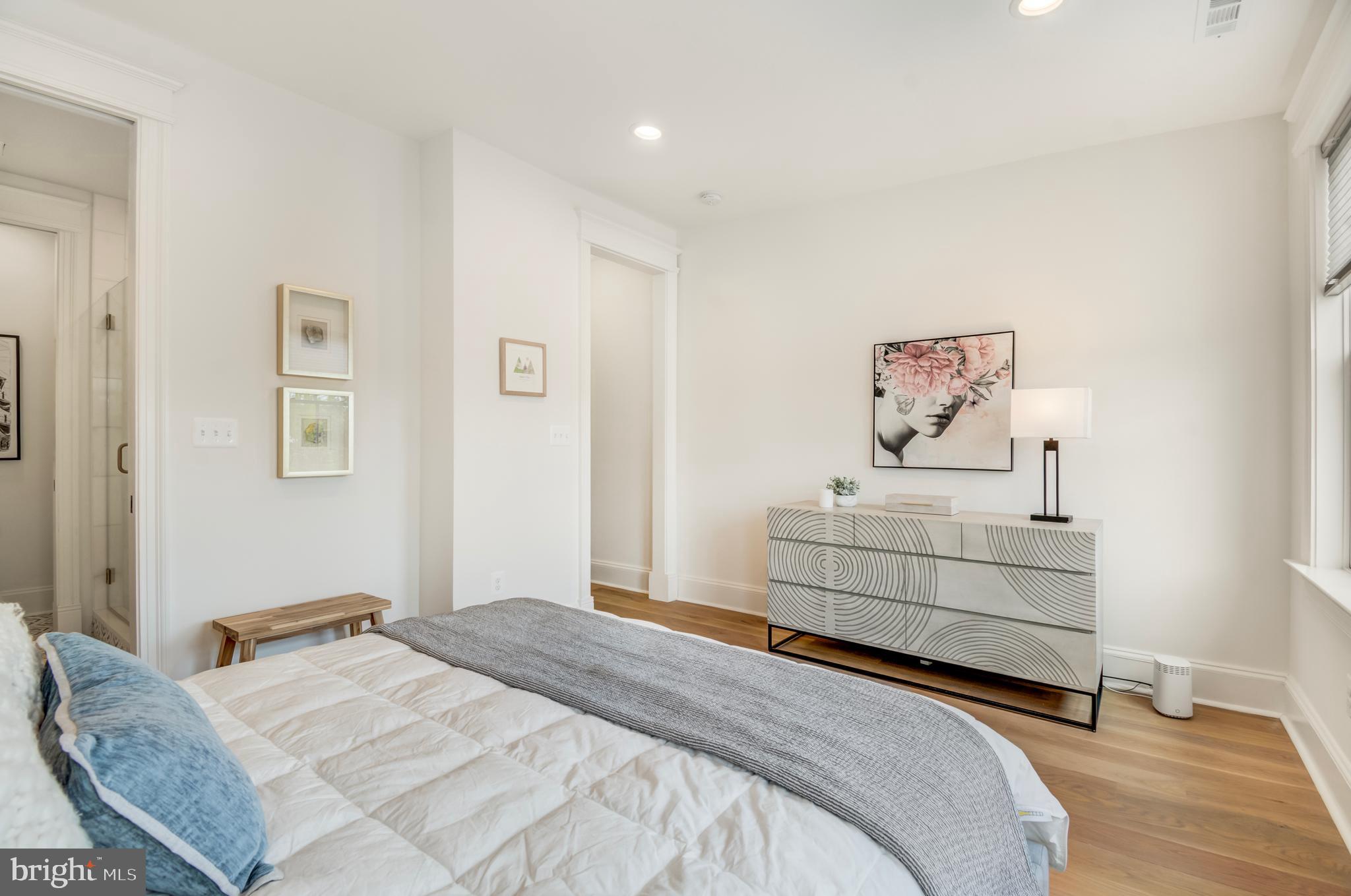 326 D Street Northeast Washington, DC 20002 - Photo 23 of 53 a bedroom with a bed and painting on the wall
