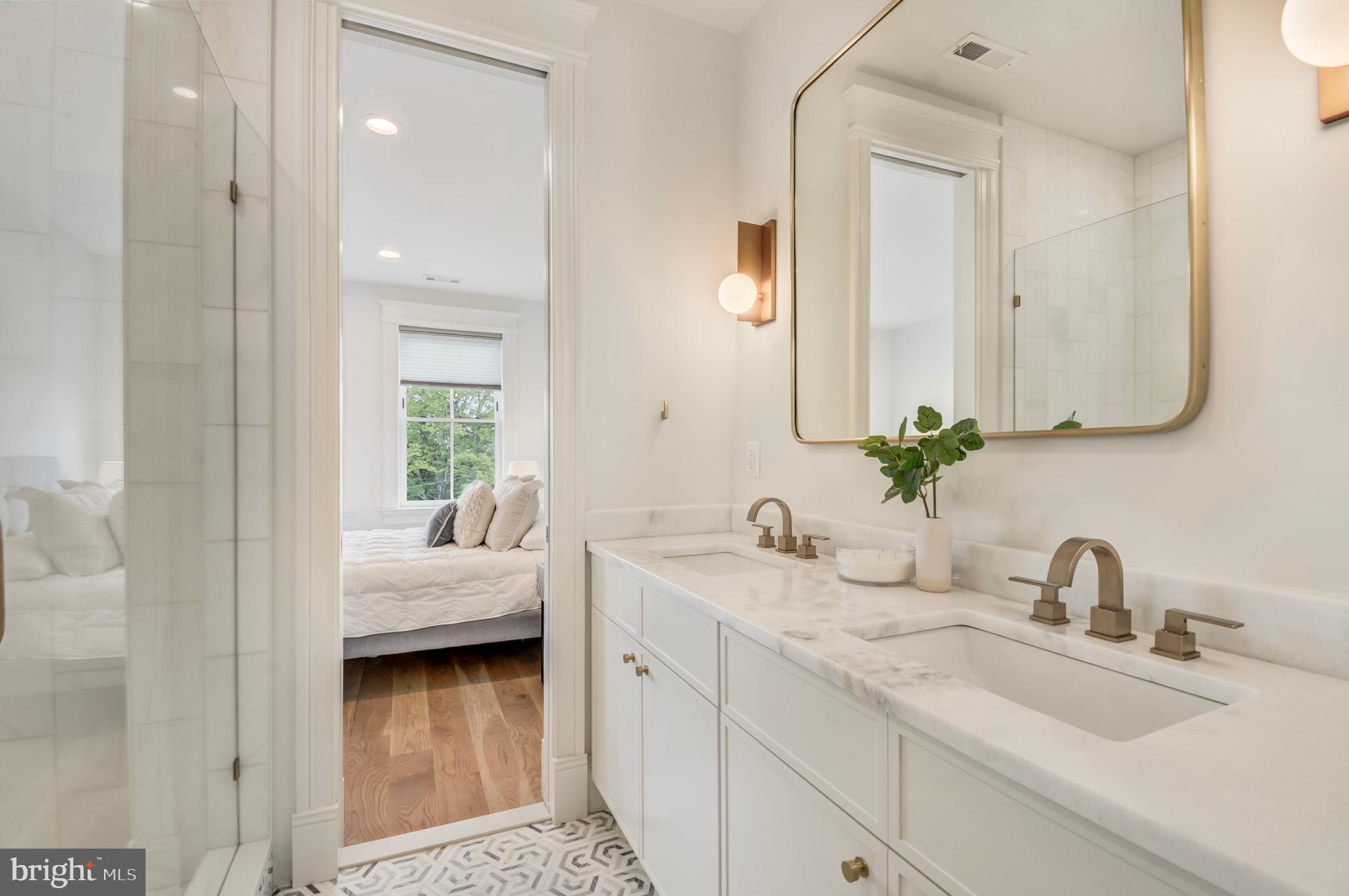 326 D Street Northeast Washington, DC 20002 - Photo 25 of 53 a en suite bathroom with double sink and a mirror