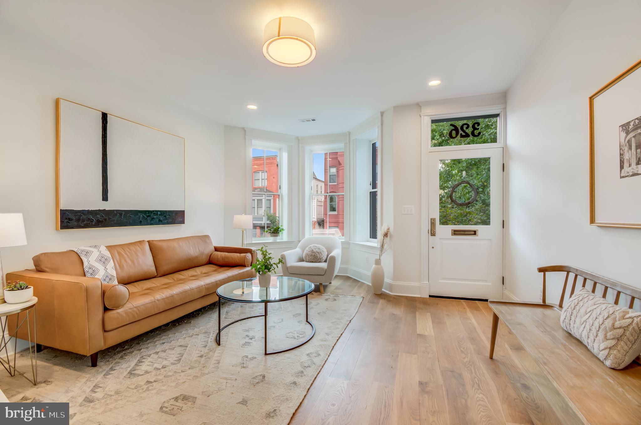 326 D Street Northeast Washington, DC 20002 - Photo 3 of 53 a living room with furniture and a wooden floor
