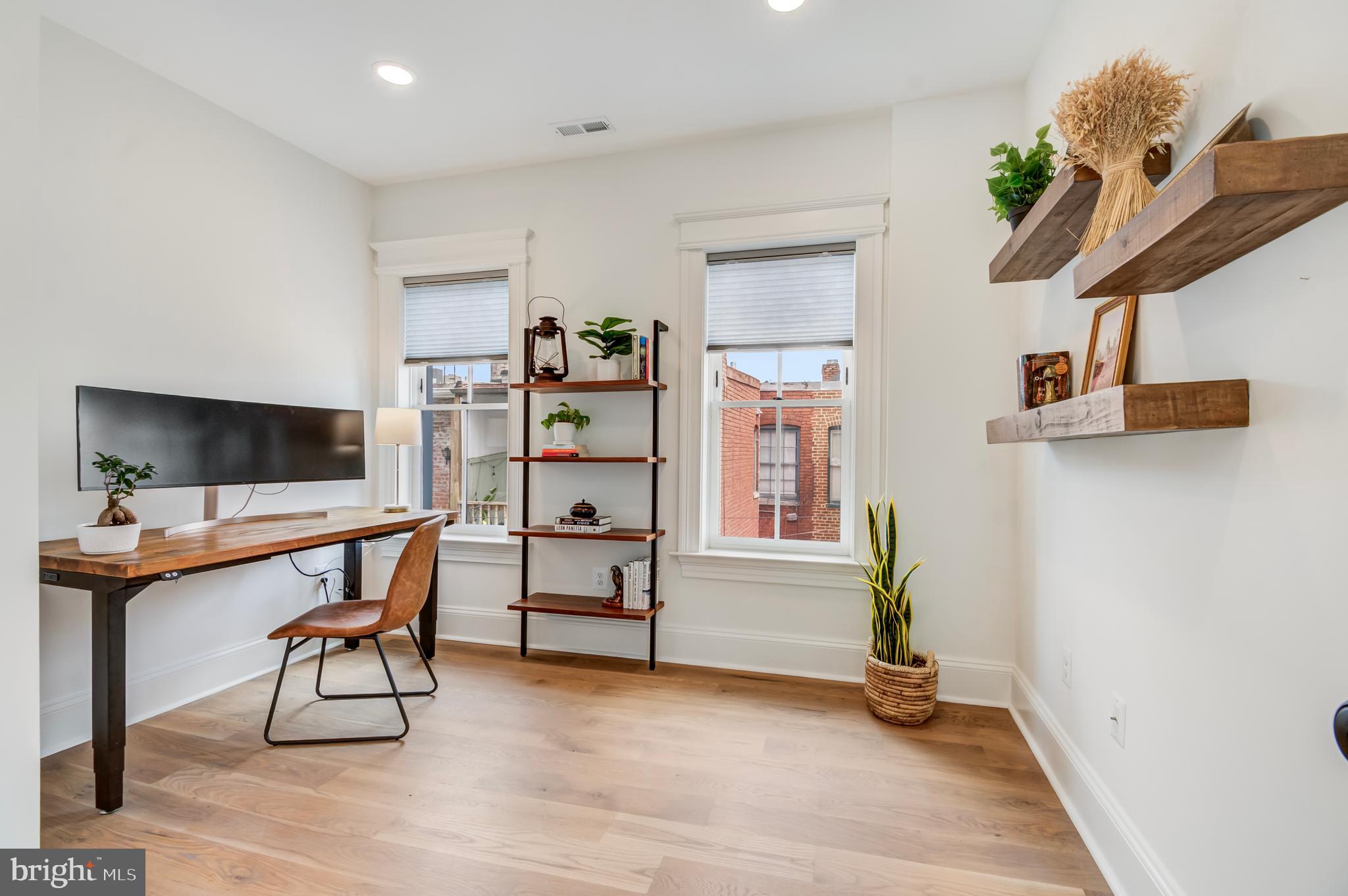 326 D Street Northeast Washington, DC 20002 - Photo 29 of 53 a view of a workspace with furniture and a window