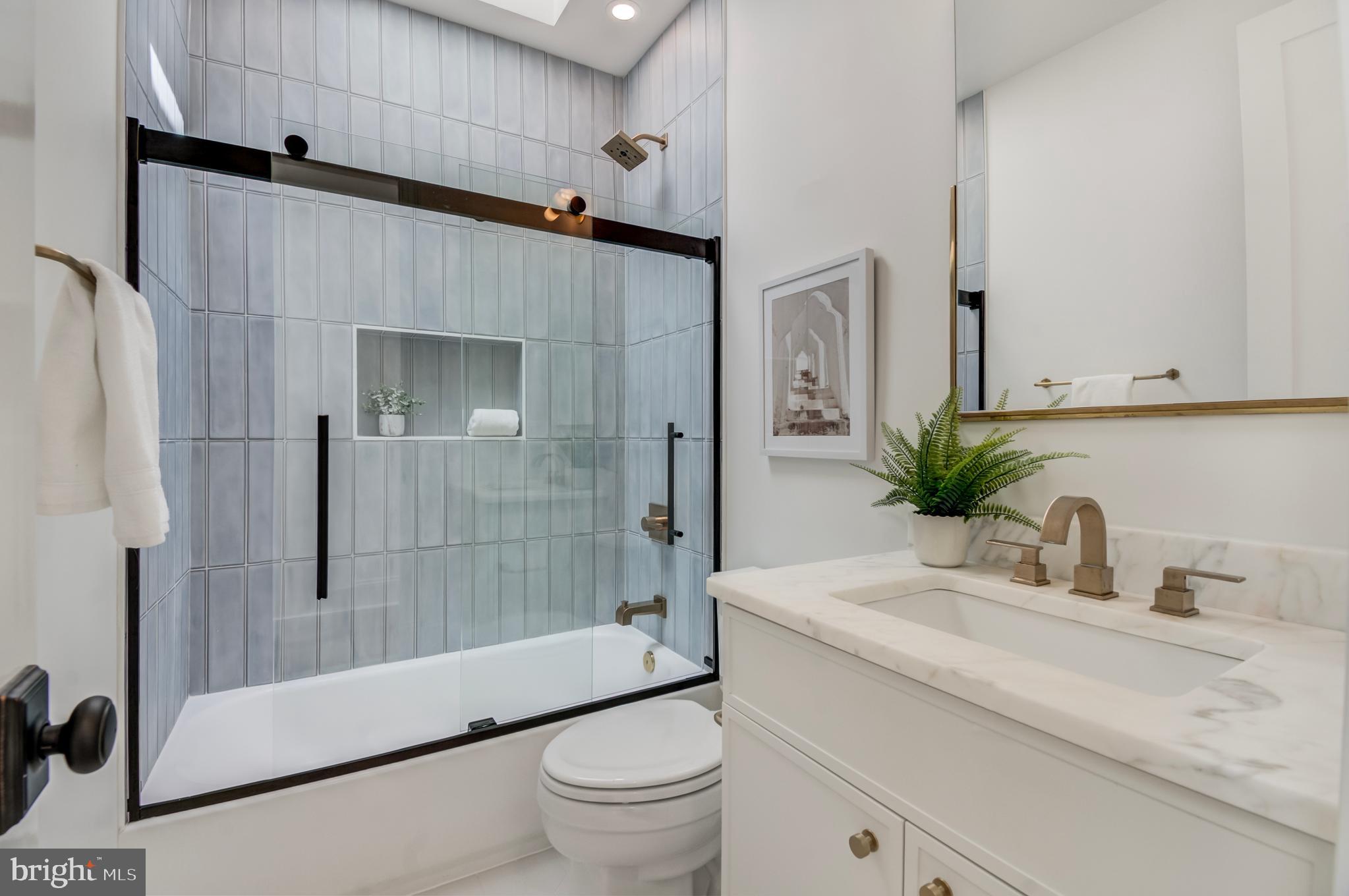 326 D Street Northeast Washington, DC 20002 - Photo 32 of 53 a bathroom with a sink a toilet and shower