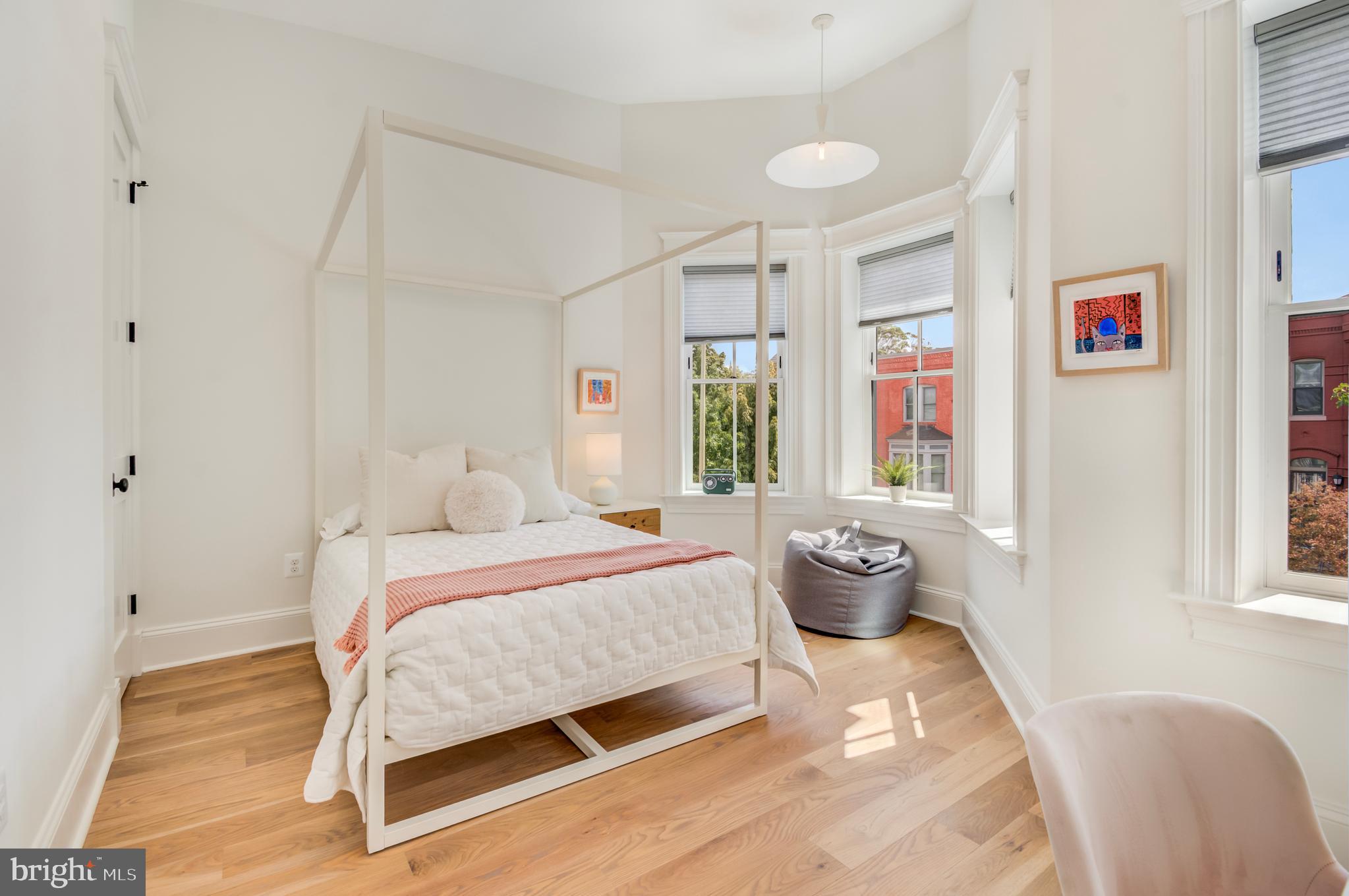 326 D Street Northeast Washington, DC 20002 - Photo 33 of 53 a bedroom with a bed and wooden floor