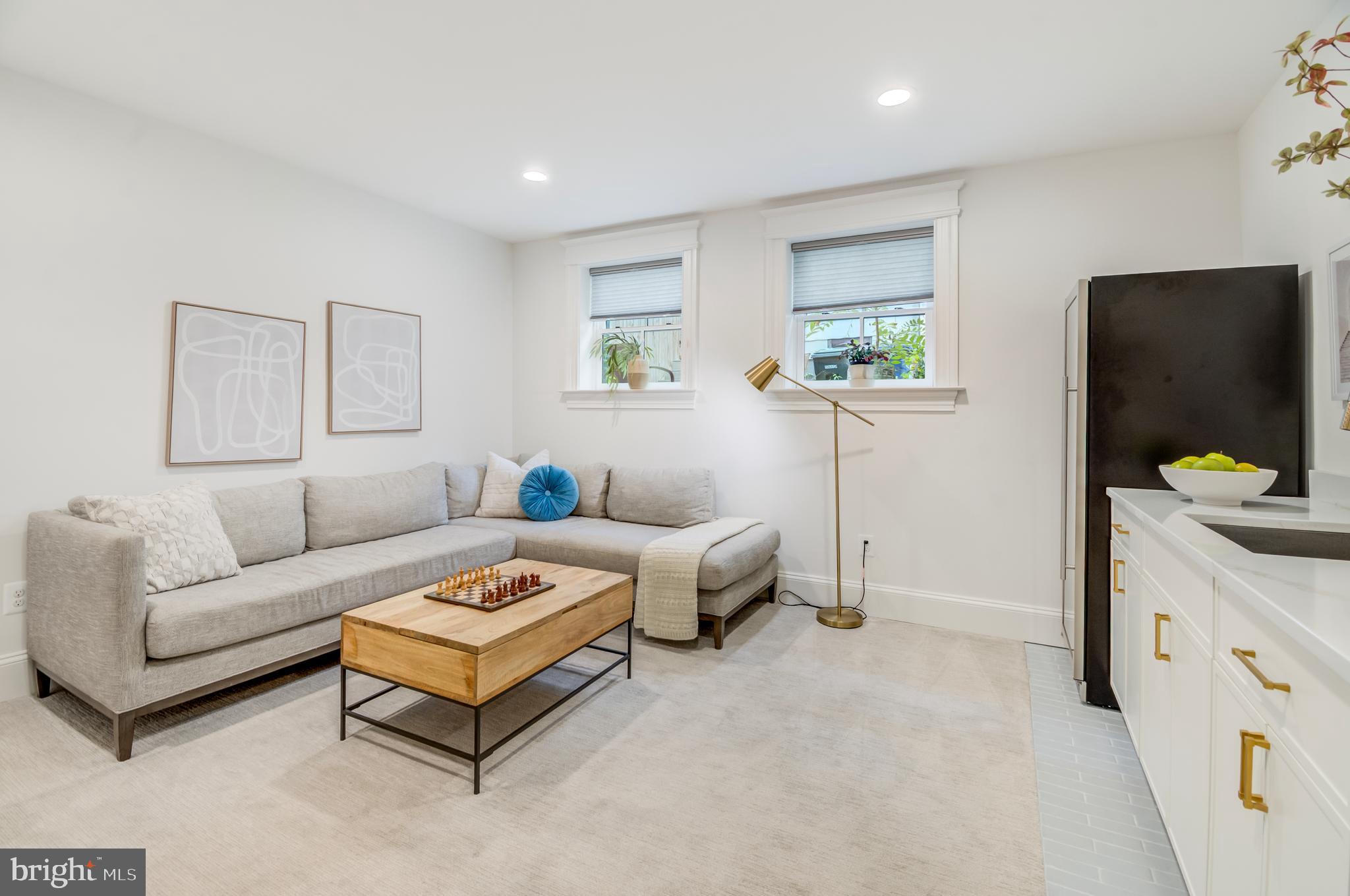 326 D Street Northeast Washington, DC 20002 - Photo 36 of 53 a living room with furniture and a flat screen tv