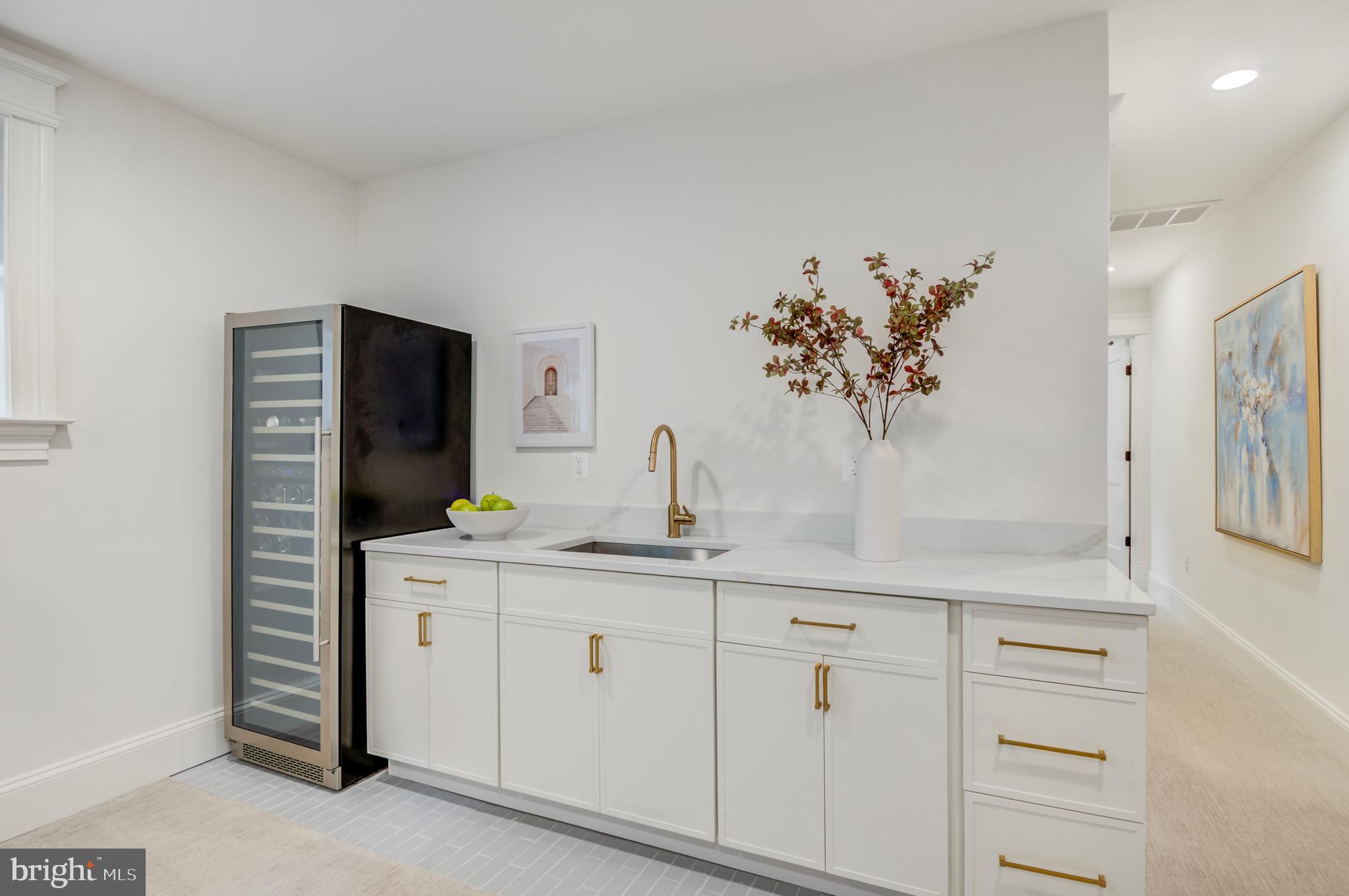 326 D Street Northeast Washington, DC 20002 - Photo 39 of 53 a view of cabinets a sink and a window