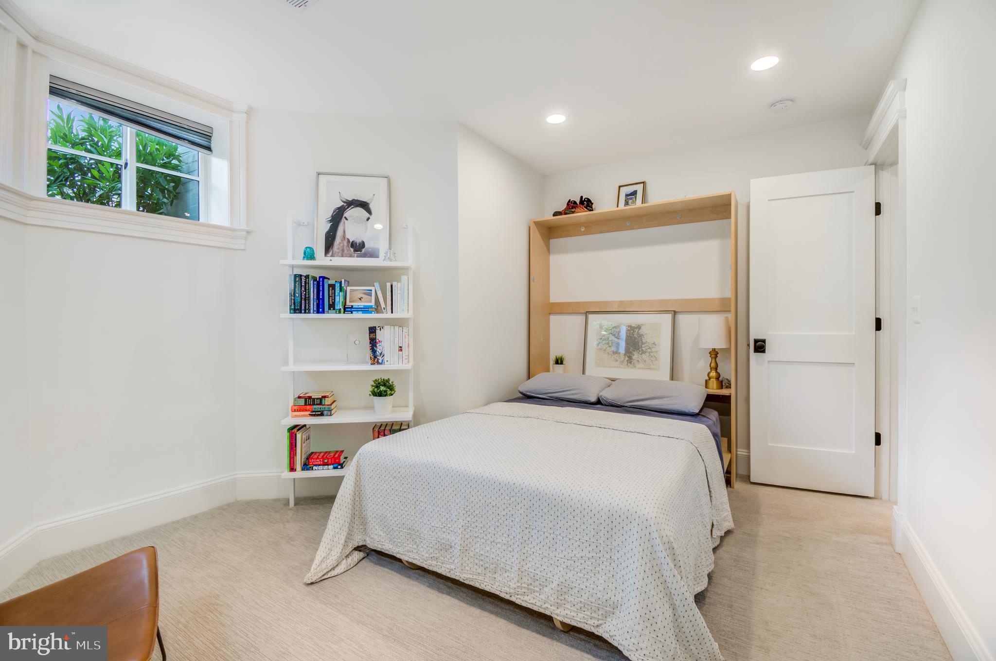 326 D Street Northeast Washington, DC 20002 - Photo 41 of 53 a bedroom with a bed and a window