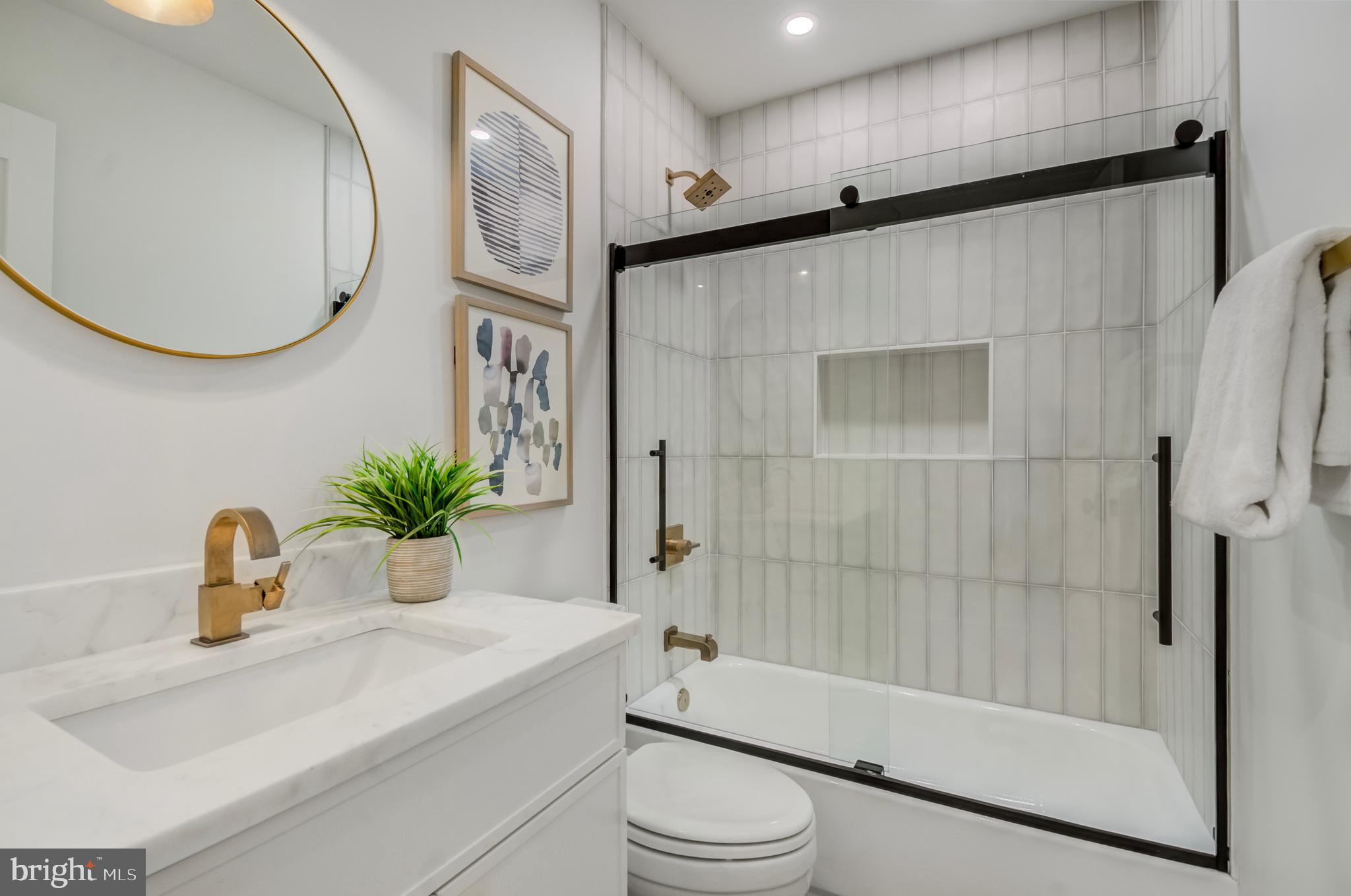326 D Street Northeast Washington, DC 20002 - Photo 43 of 53 a bathroom with a sink a toilet and a mirror