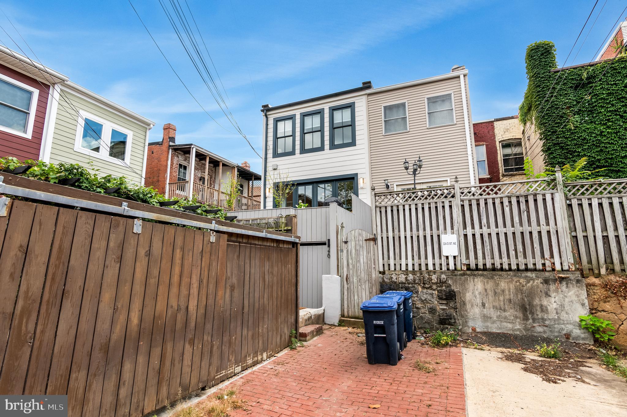 326 D Street Northeast Washington, DC 20002 - Photo 48 of 53 a front view of a house with a garden