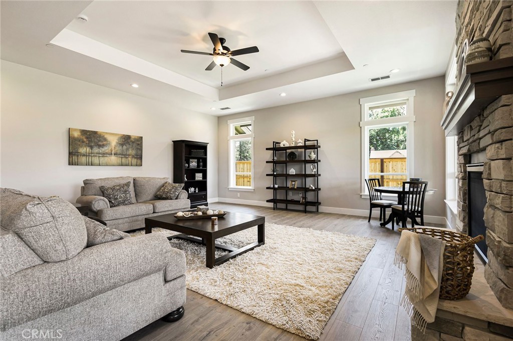 3 Haystack Court Chico, CA 95973 - Photo 15 of 75 a living room with furniture and a flat screen tv with wooden floor